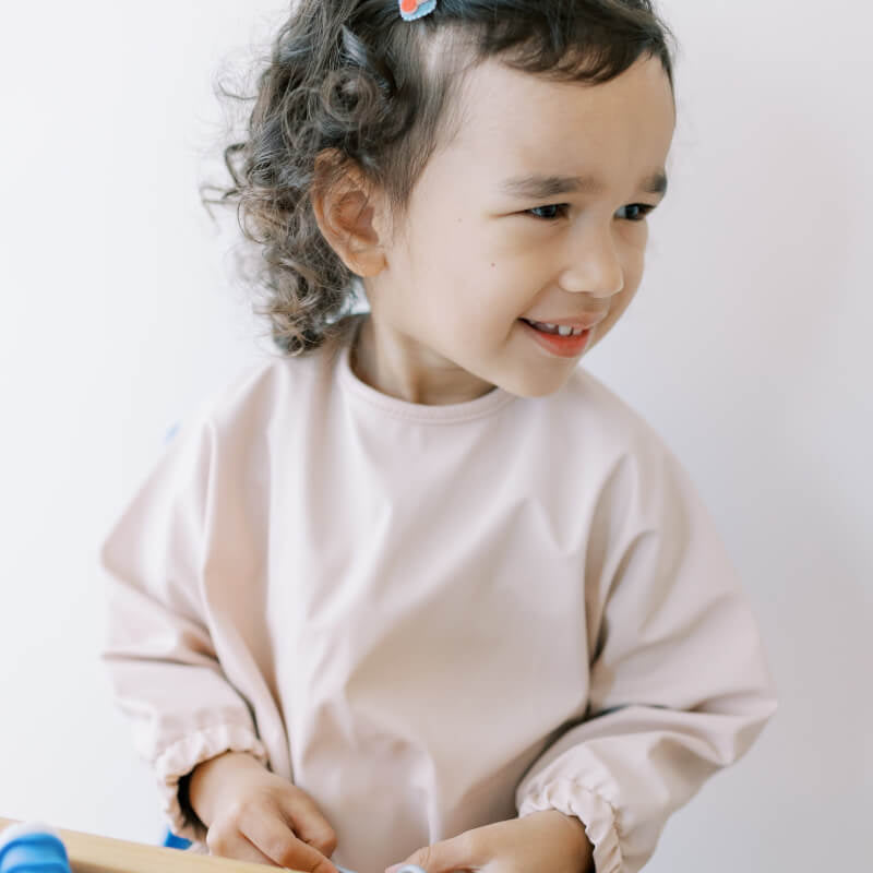 Milk It Baby Sleeved Bib - Coral Pink